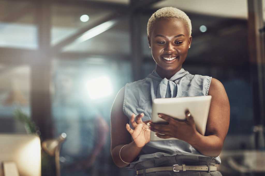 Smile, tablet and search with black woman in office for technology, corporate and communication. Social media, connection and internet with female and online for networking, email and website